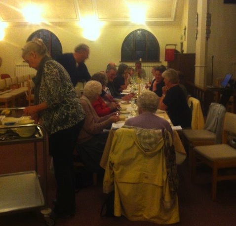 Enjoying the traditional Maundy Thursday meal at St Francis' Church.