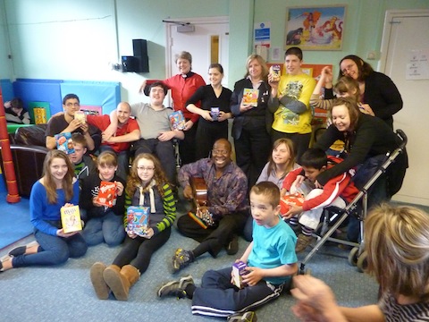 Visitors from St Francis' Church with children at Cherry Trees and larger than life TV presenter and entertainer Dave Benson Phillips.